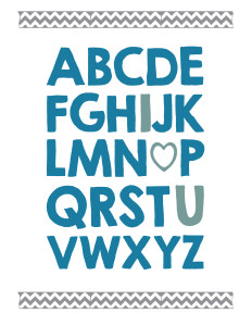 Alphabet written in thick blue letters with I, O replaced by a heart, and U in lighter blue and chevron washi tape above and below. 