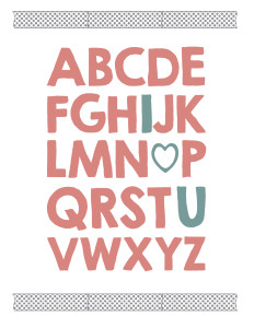Alphabet written in thick pink letters with I, O replaced by a heart, and U in blue and chevron washi tape above and below. 