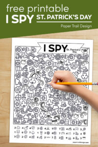 St. Patrick's Day themed I spy game with kids hand holding pencil with text overlay- free printable I spy St. Patrick's Day 