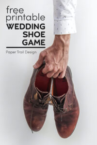 Man's arm holding dress shoes with text overlay- free printable wedding shoe game