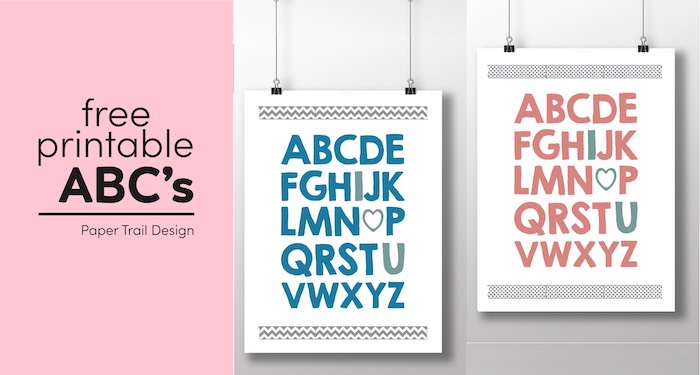 Two wall art prints in blue and pink with the complete ABC's with I, heart, and U written in a different colors suspended from clips with text overlay-free printable ABC's.