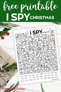 I Spy Christmas game activity and holly and present in the background with text overlay- free printable I spy activity