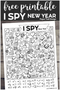 I Spy New Year activity page on a wood background with text overlay- free printable I Spy New Year. 