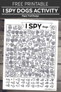 Dog I spy activity page on wood background with text overlay- free printable I spy dogs activity