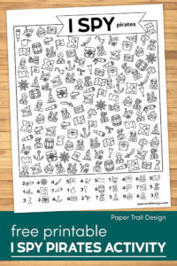 Pirate themed I spy kids activity page on a wood background with text overlay- free printable I Spy Pirates activity