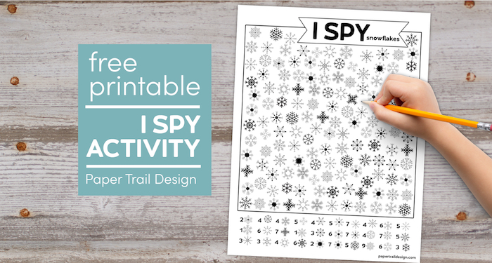 Snowflake I spy page with kids hand holding pencil with text overlay- free printable I spy activity