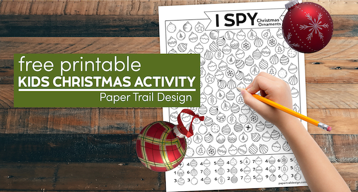 I spy Christmas ornament activity with child's hand holding pencil and text overlay- free printable kids Christmas activity